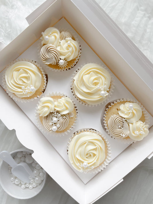 6 cupcakes with sprinkles