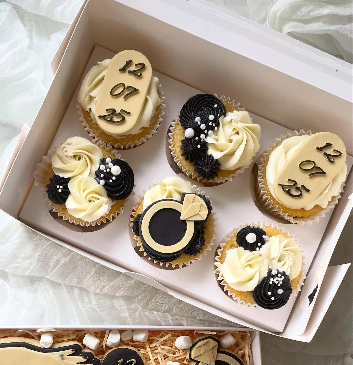 6 engagement cupcakes with sprinkles
